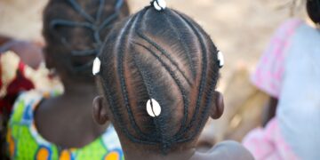 African braids with traditional cauri shell - hairdo cornrow